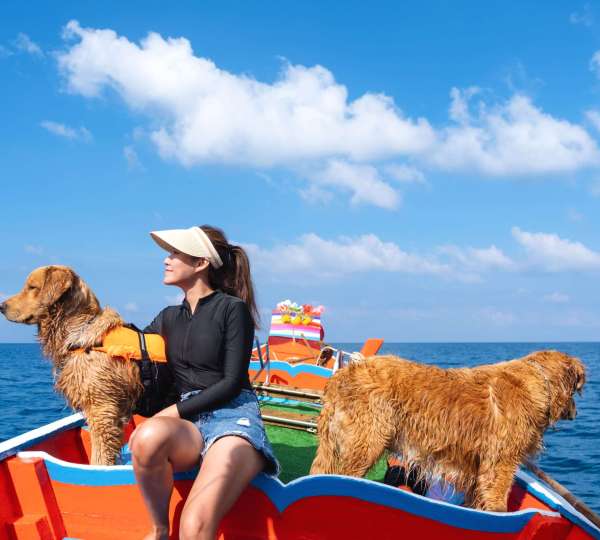 a-woman-sitting-on-a-boat-and-enjoying-sailing-on-2022-12-16-05-05-25-utc